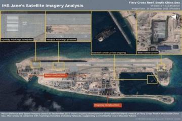 South China Sea tensions surge as China lands plane on artificial island